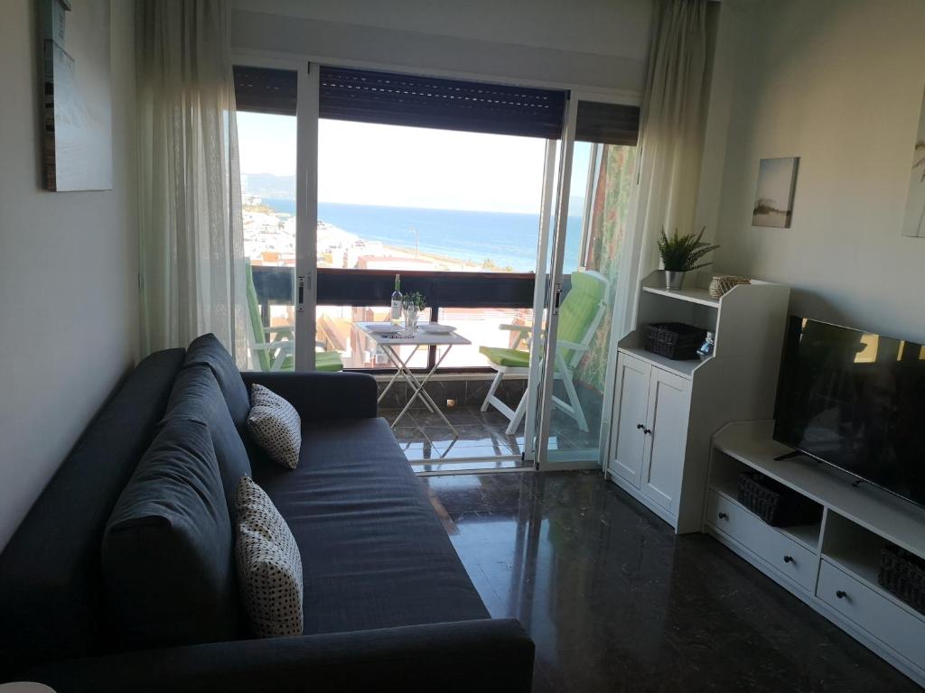 Część wypoczynkowa w obiekcie APARTAMENTO 1ª LINEA PLAYA GARAJE PISCINAS TERRAZA