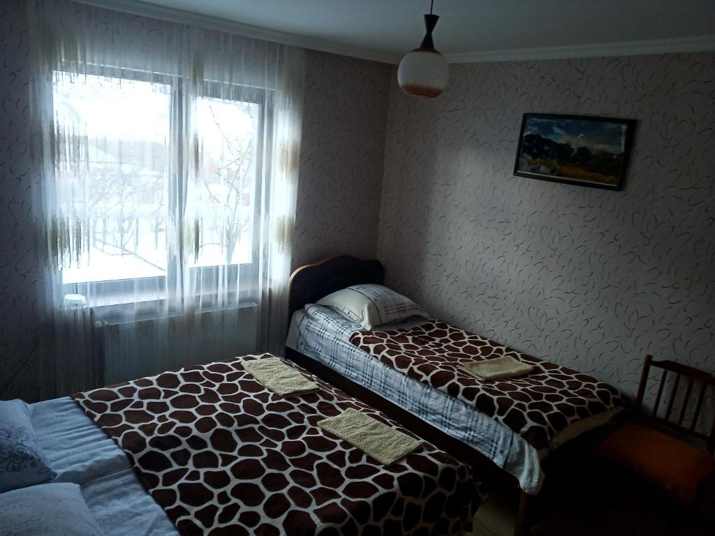 Postel nebo postele na pokoji v ubytování Guest House Sunset