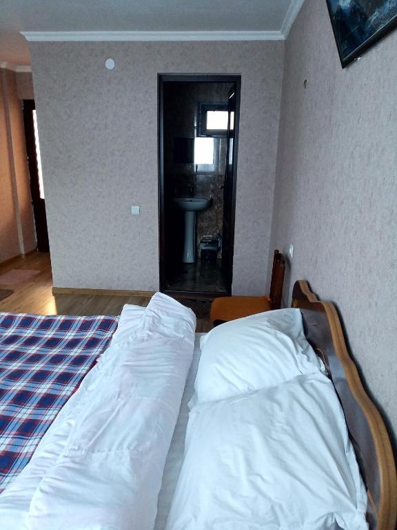 Postel nebo postele na pokoji v ubytování Guest House Sunset