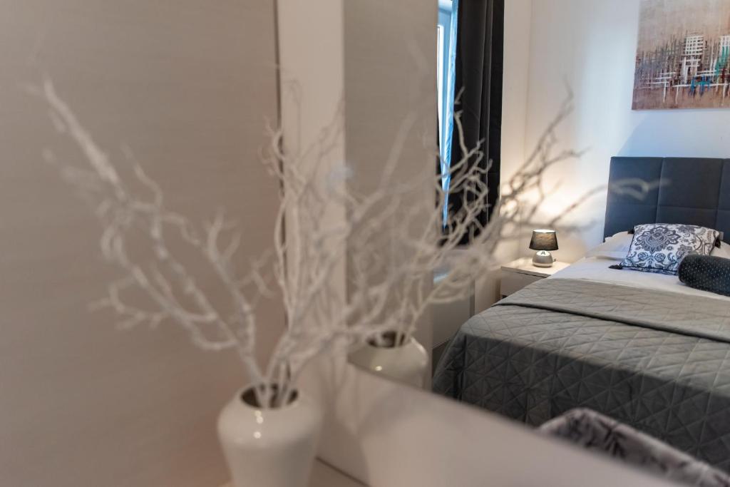 Posteľ alebo postele v izbe v ubytovaní Apartments Sutalo