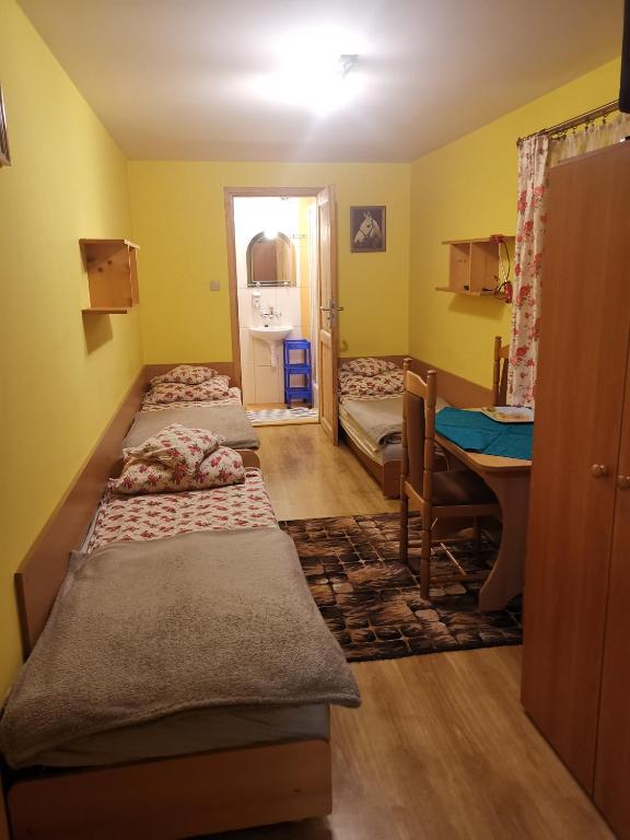 Posteľ alebo postele v izbe v ubytovaní Pokoje u Arka