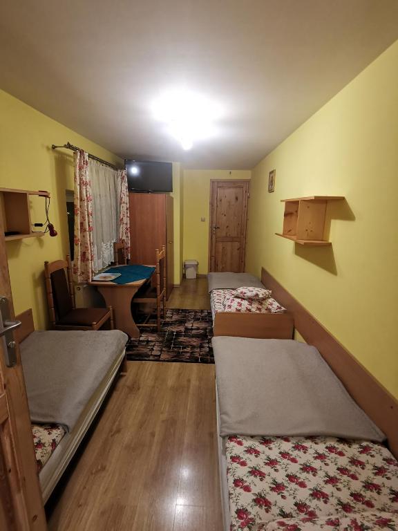 Posteľ alebo postele v izbe v ubytovaní Pokoje u Arka