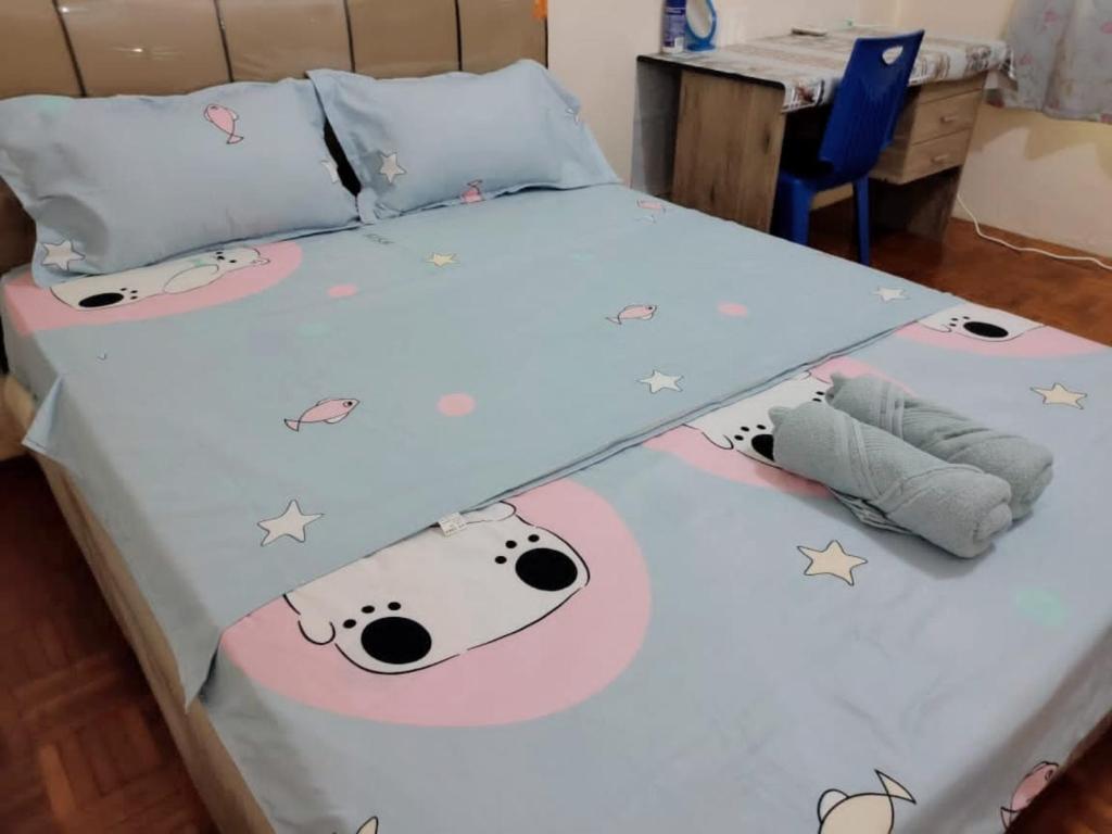 Postel nebo postele na pokoji v ubytování NH Homestay Sibu