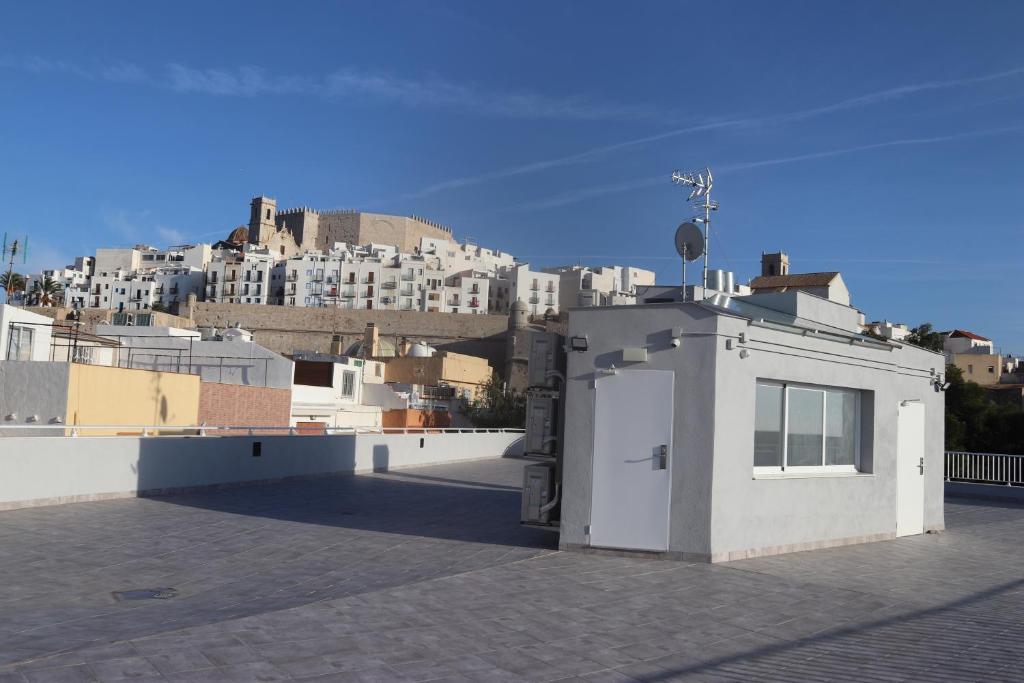 a building on top of a roof with a city at APARTAMENTOS AGUAMARINA in Peniscola