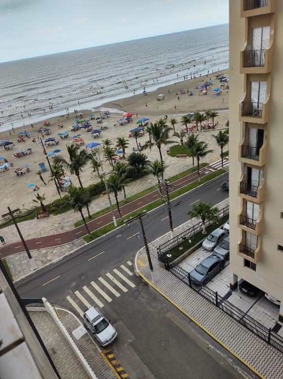 a view of the beach from a balcony of a building at Apartamento vista pro Mar in Praia Grande