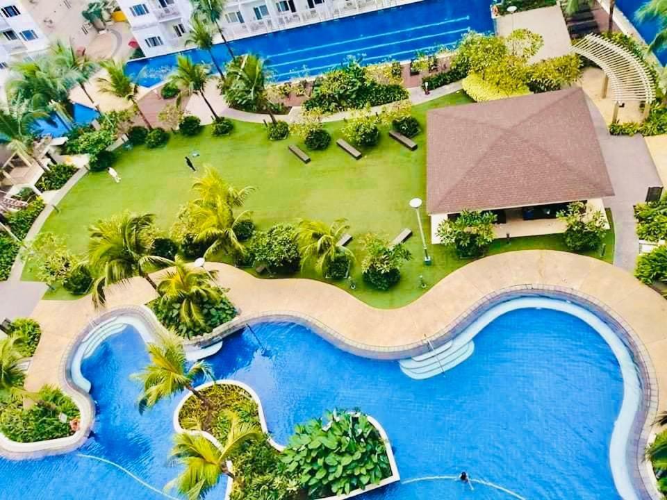 an aerial view of the pool at the resort at SHELL RESIDENCE c4 shortwalk Mall of Asia near airport in Manila