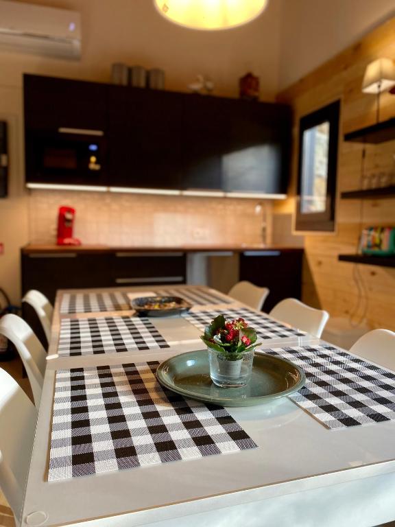 a table with a black and white checkered table cloth at Forest Lodge in Petit Mesnil