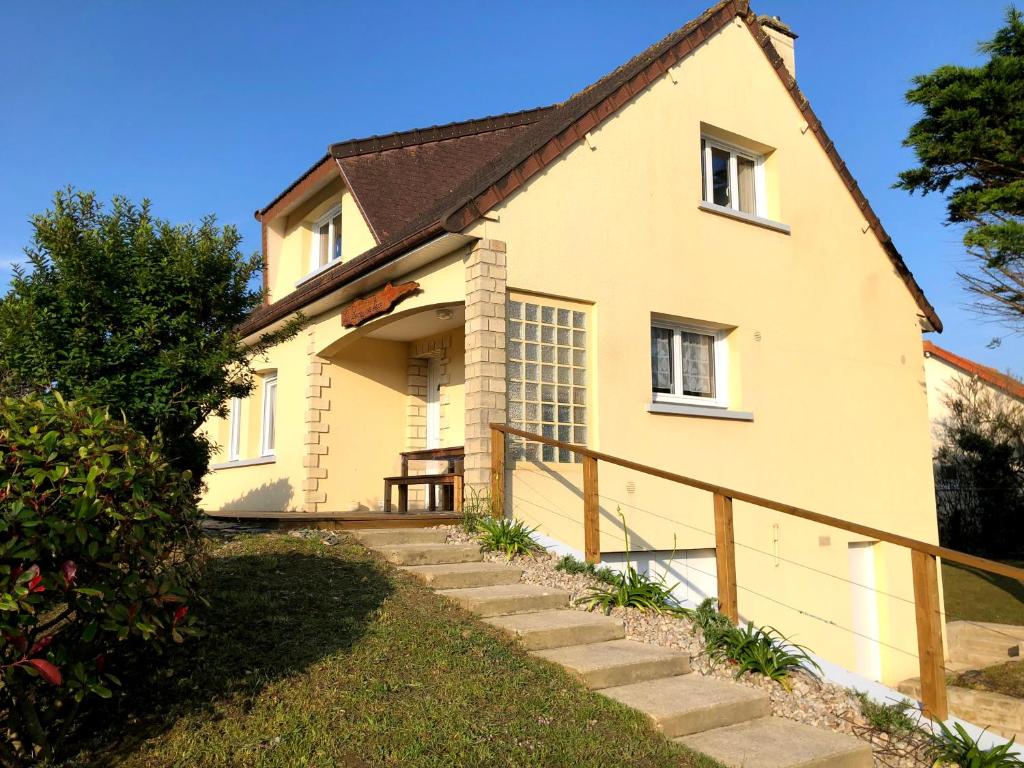 a house with a staircase leading up to it at Les pierres de Lecq in Portbail