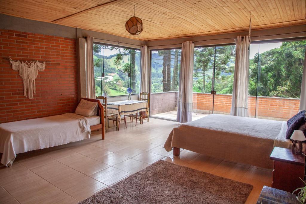 Ένα ή περισσότερα κρεβάτια σε δωμάτιο στο Oca Roça