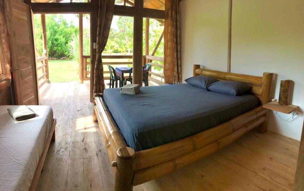 Postel nebo postele na pokoji v ubytování Quinta El Mamey