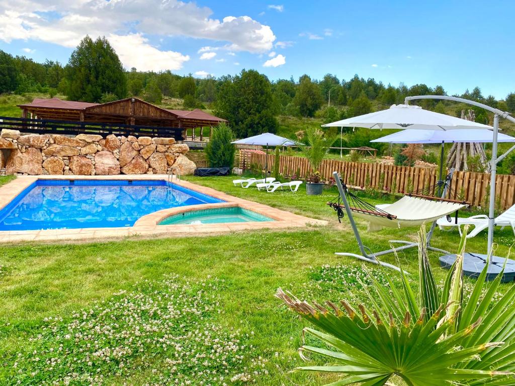 The swimming pool at or close to El BURGO DE OSMA ALOJAMIENTO RURAL VILLA BAGH