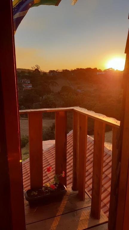 a view of the sunset from the balcony of a house at B&B Sol Poente in Cunha