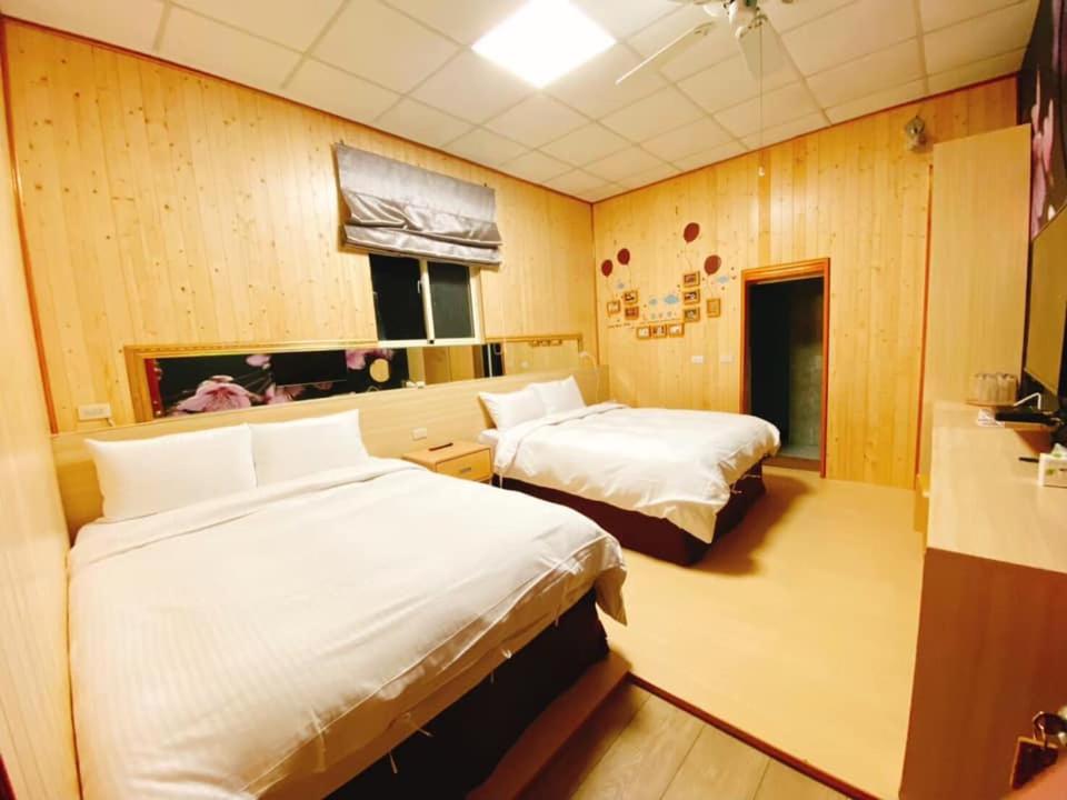 Postel nebo postele na pokoji v ubytování 山旅民宿