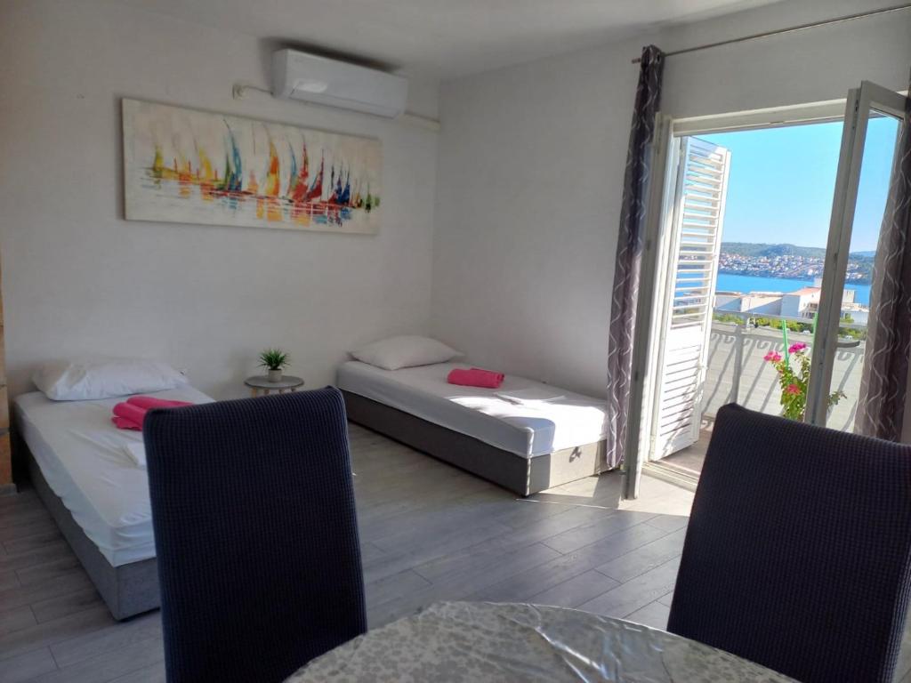 Postel nebo postele na pokoji v ubytování Apartman Marica