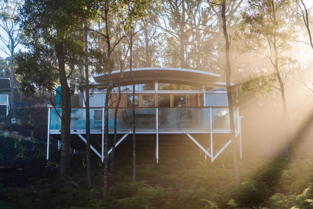 a house in the middle of a forest at Free Spirit Pods in Barnes Bay