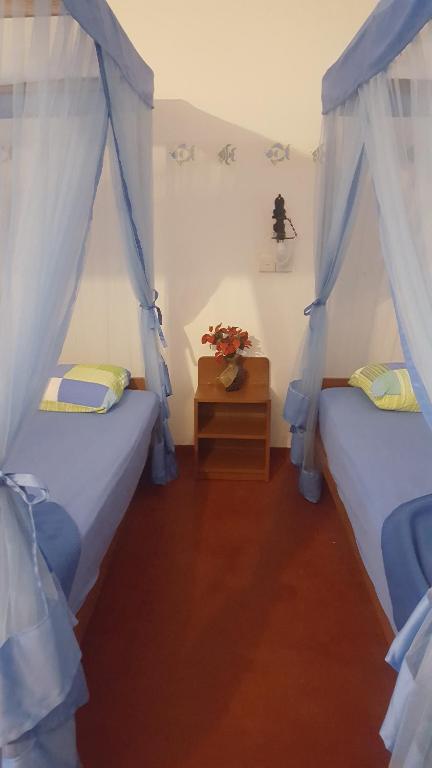 Postel nebo postele na pokoji v ubytování Gasthaus Langeoog