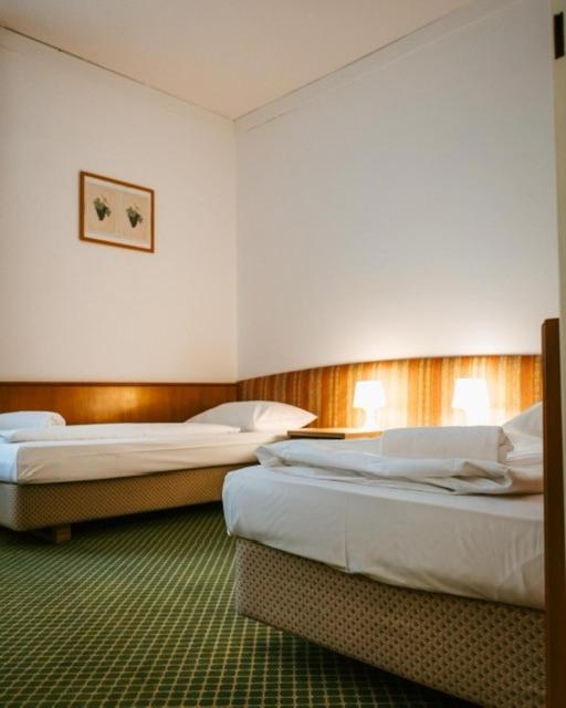 Postel nebo postele na pokoji v ubytování Hotel Am Sachsengang