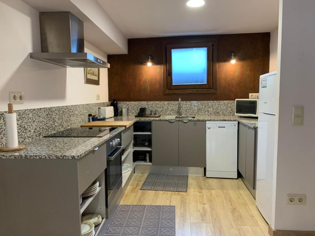 Kuchyň nebo kuchyňský kout v ubytování Apartament Forn d'ITA