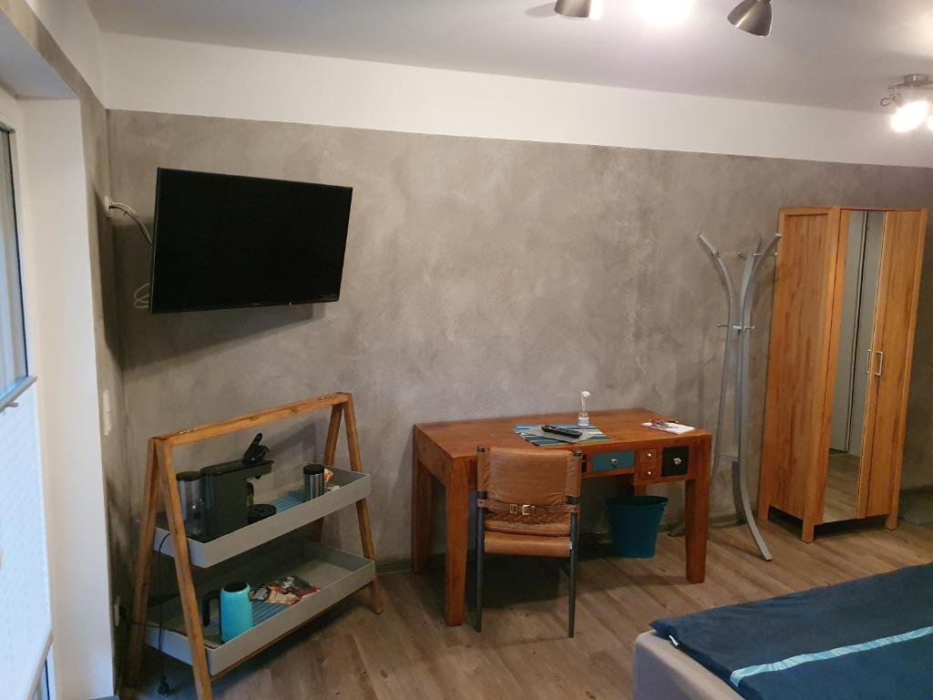 TV a/nebo společenská místnost v ubytování Aparthotel-Stadtallendorf