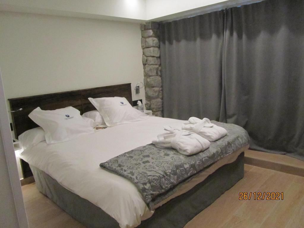 Postel nebo postele na pokoji v ubytování Mauberme Mountain Boutique Hotel