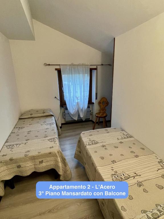 A bed or beds in a room at Il Tiglio Gressan