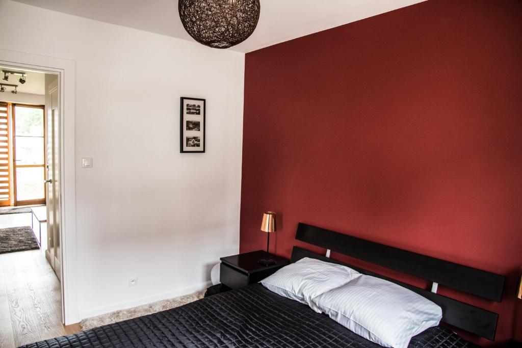 Posteľ alebo postele v izbe v ubytovaní "Rodzinny Apartament pod Śnieżką" na osiedlu "Apartamenty pod Śnieżką"