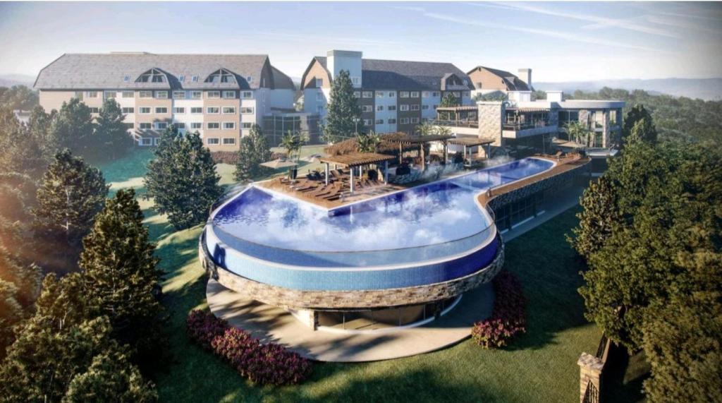 a rendering of a resort with a swimming pool at Golden Gramado Resort Laghetto in Gramado