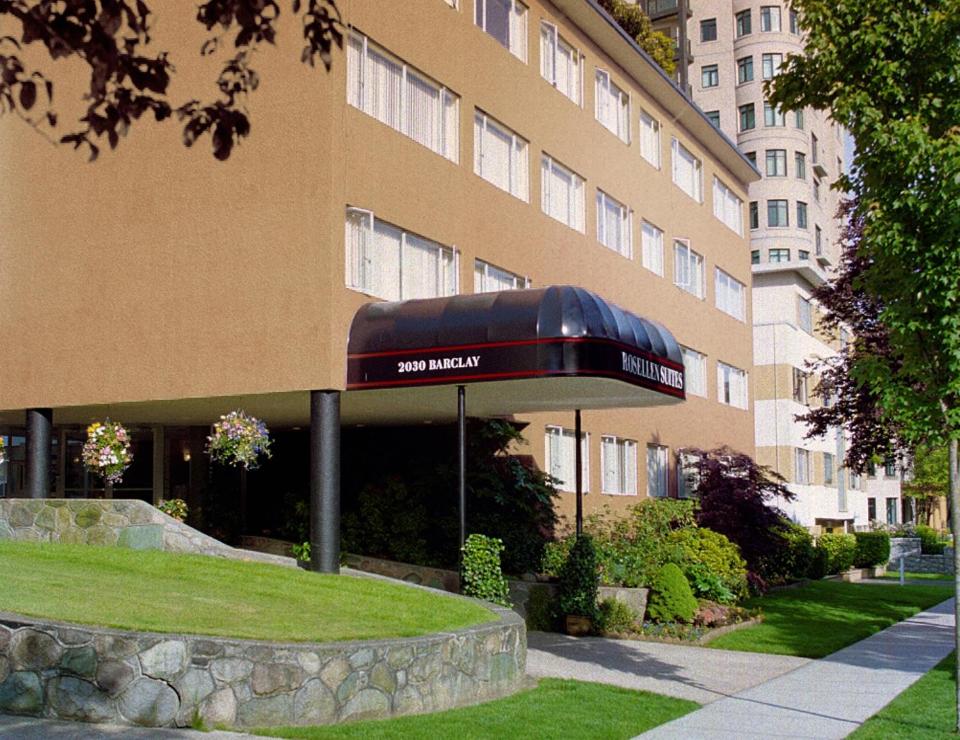 a building with awning in front of a building at Rosellen Suites at Stanley Park in Vancouver