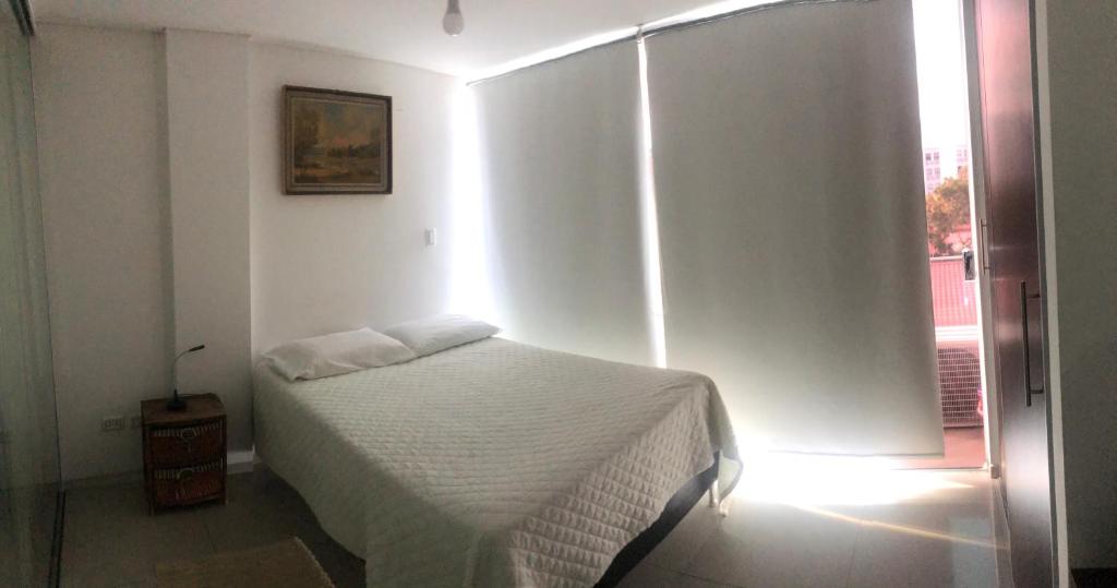 Ένα ή περισσότερα κρεβάτια σε δωμάτιο στο Depto Equipe