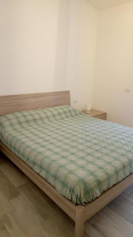 Łóżko lub łóżka w pokoju w obiekcie STELLA MARIS Sardinia