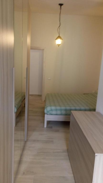 Łóżko lub łóżka w pokoju w obiekcie STELLA MARIS Sardinia