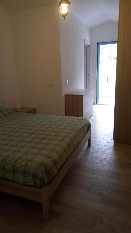 Łóżko lub łóżka w pokoju w obiekcie STELLA MARIS Sardinia