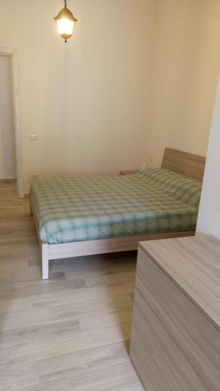 Łóżko lub łóżka w pokoju w obiekcie STELLA MARIS Sardinia