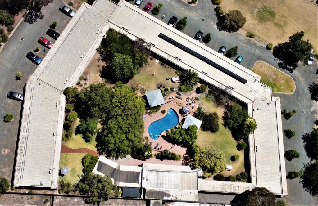 an aerial view of a large building with a pool at River Country Inn in Moama