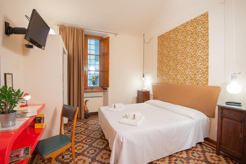 Postel nebo postele na pokoji v ubytování Hotel Diana & Depandance