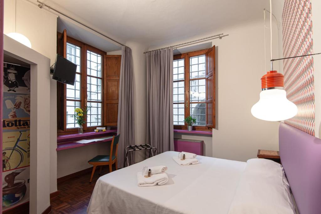 Postel nebo postele na pokoji v ubytování Hotel Diana & Depandance