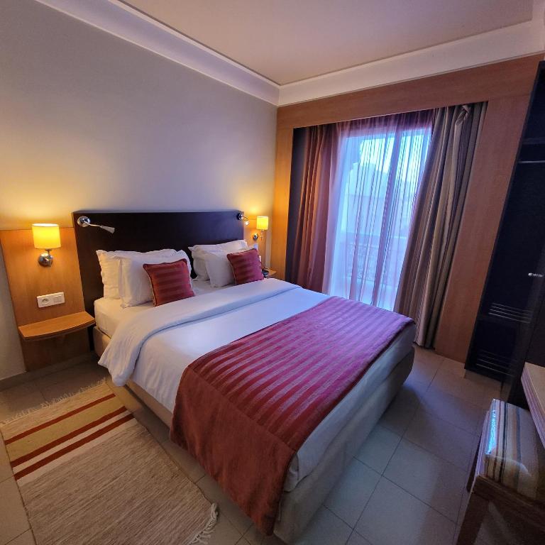 Cama o camas de una habitación en Hotel Tiba