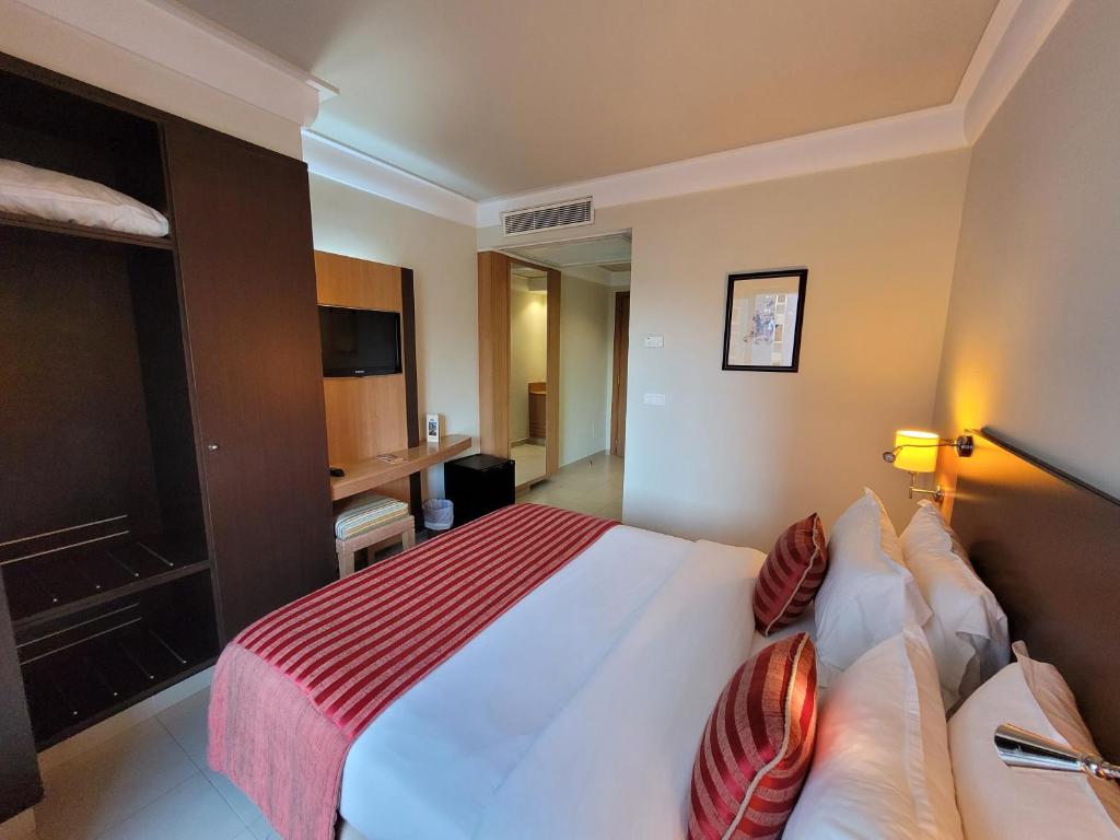 Cama o camas de una habitación en Hotel Tiba