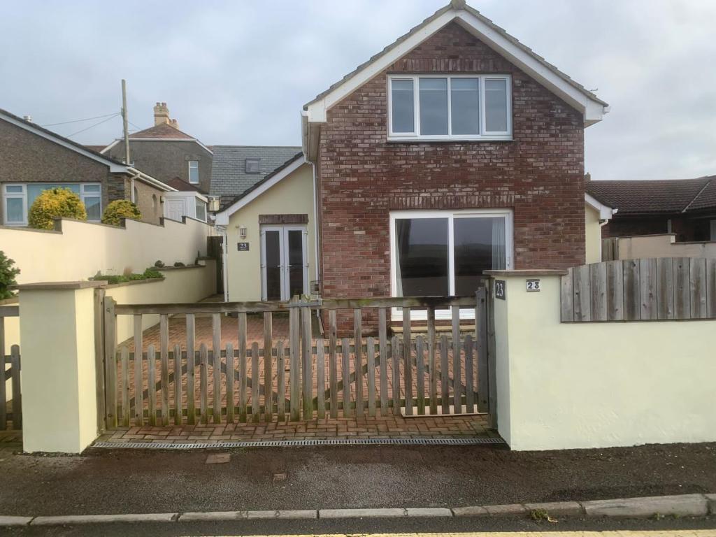a house with a gate and a fence at Bescot House Bramble Hill Bude 4 bed det house in Bude