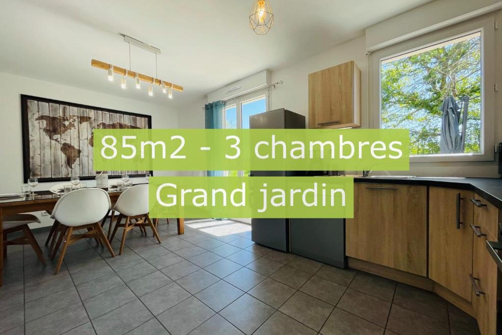 a kitchen and dining room with a table and chairs at New house in the heart of a hamlet near Amboise and Chenonceaux in Athée-sur-Cher