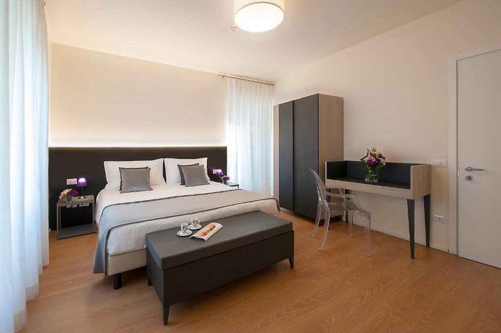 Postel nebo postele na pokoji v ubytování Hotel La Corte
