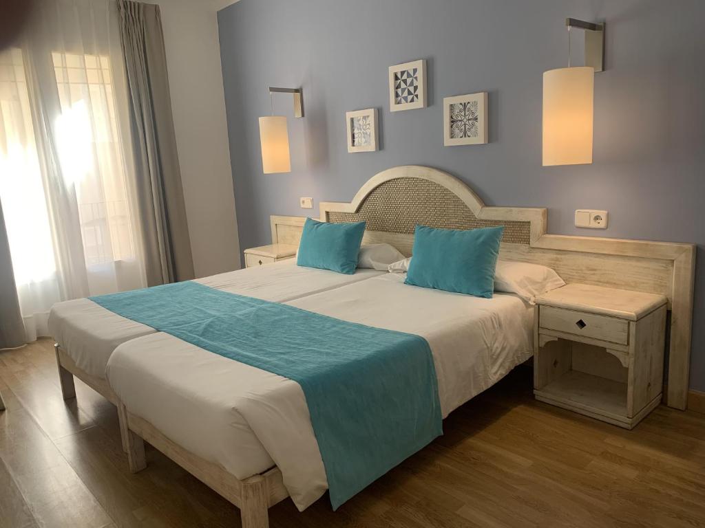 Voodi või voodid majutusasutuse Hostal HPC Porto Colom toas