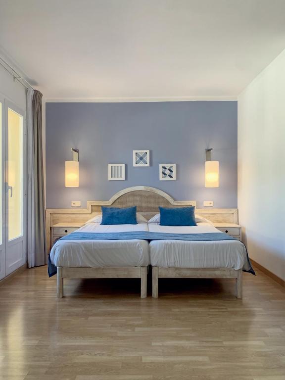 Voodi või voodid majutusasutuse Hostal HPC Porto Colom toas