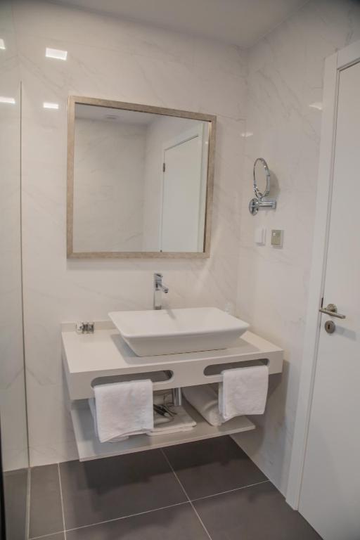 Koupelna v ubytování Calamar Hotel