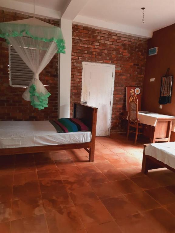 Postel nebo postele na pokoji v ubytování Gimhana farmstay
