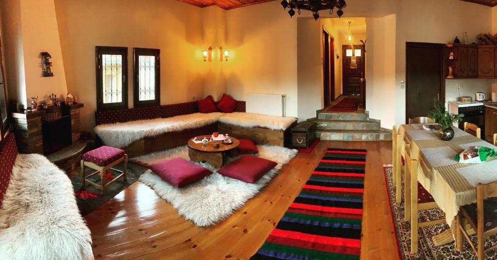 a living room with a couch and a table at “White Mountain”, Pisoderi in Pisoderi