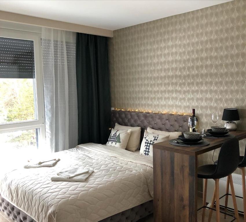 Una cama o camas en una habitación de Apartman Ambijent Divcibare