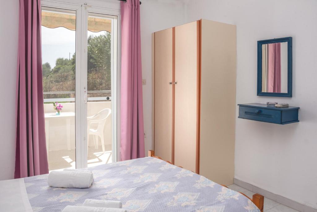Postel nebo postele na pokoji v ubytování Potamitis House