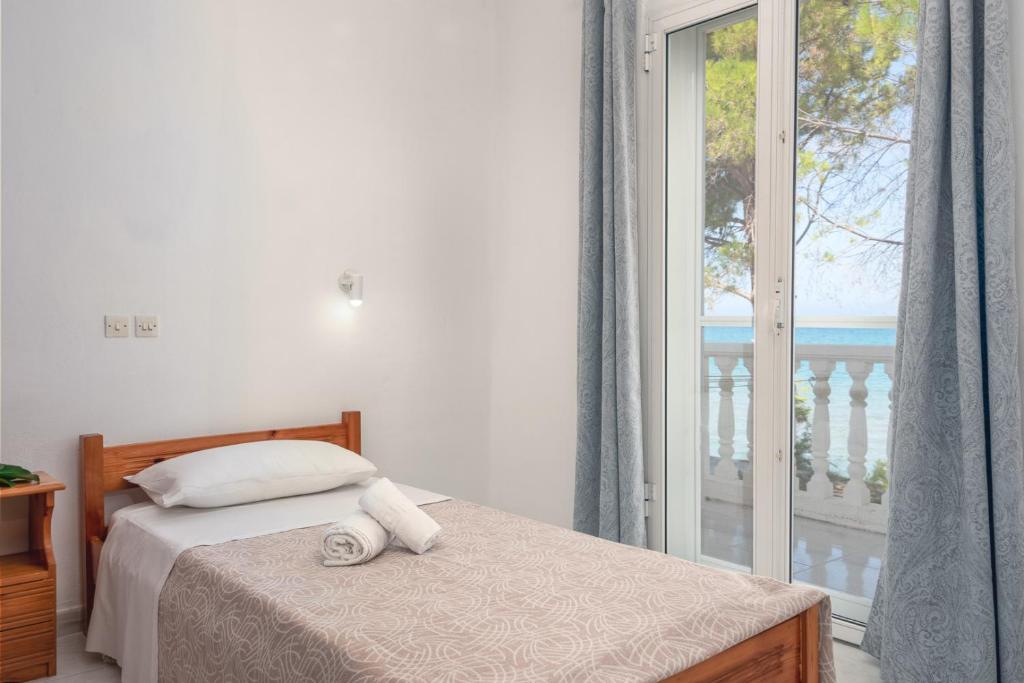Postel nebo postele na pokoji v ubytování Potamitis House