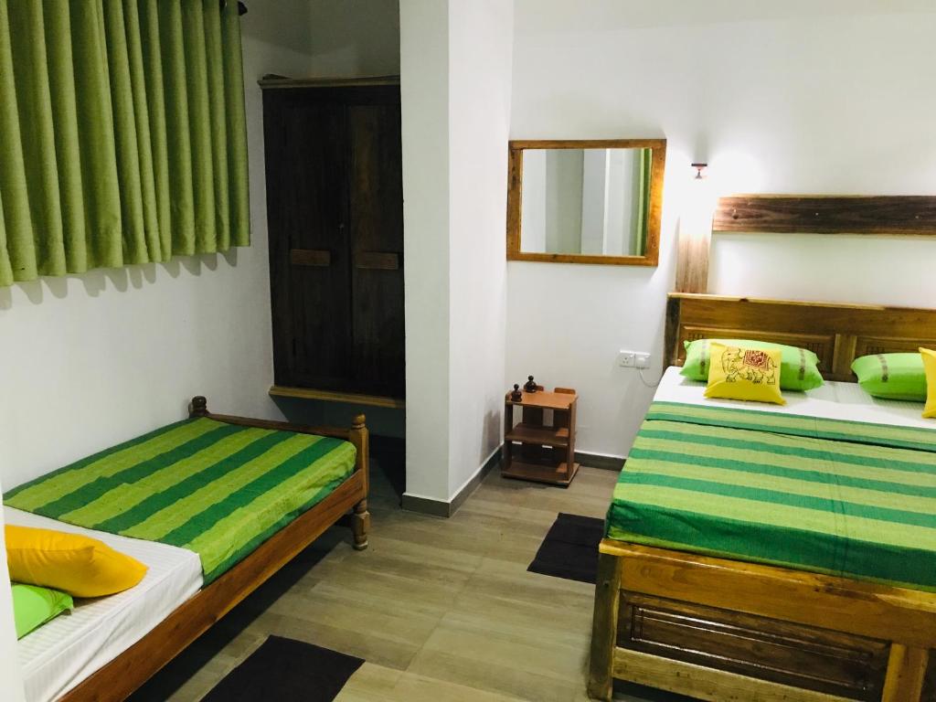 Postel nebo postele na pokoji v ubytování Ritigala Hideaway